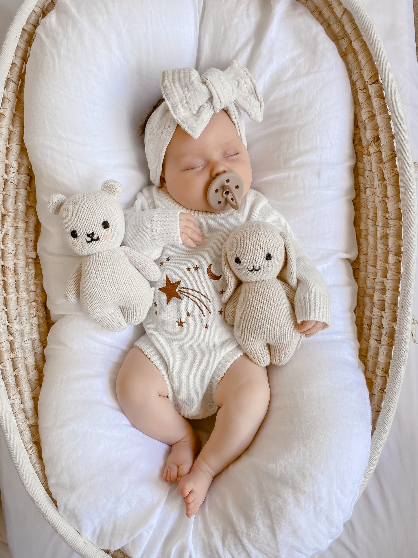 Baby girl, sleeping baby, knit romper, white knitted romper, shooting star embroidery, knit onesie