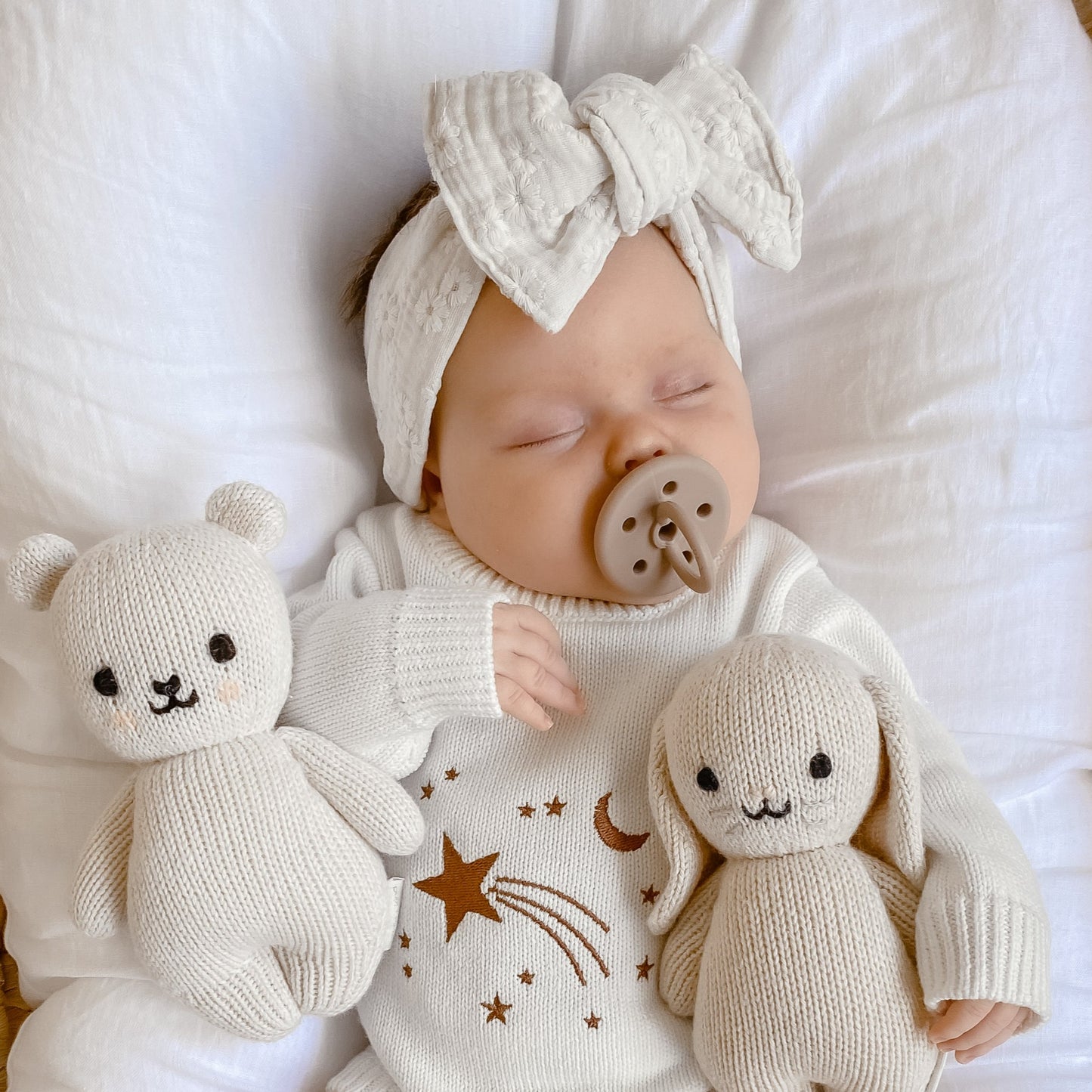 White floral baby topknot, sleeping baby girl