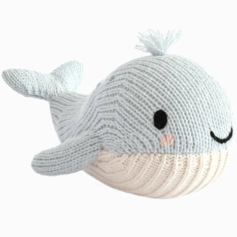 Knitted whale toy on a white background