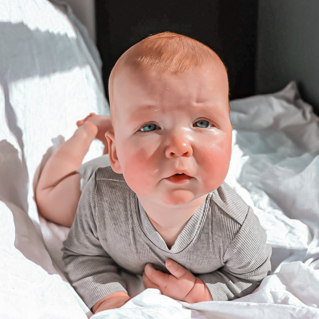 Brooklyn lou the lable. Grey and charcoal romper, long sleeve bodysuit, ribbed cotton, cute baby, baby boy clothes. Press studs & pocket